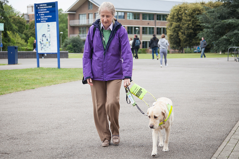 Fiona Corby walking to work with her Guide Dog, Molly