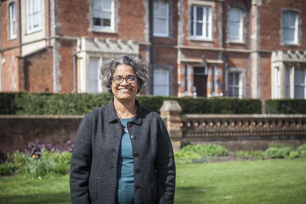 Uma Kambhampati standing in front of the university