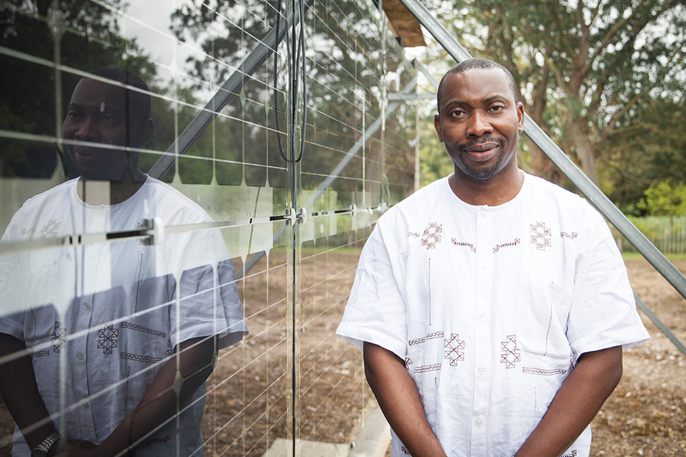 Emmanuel Essah standing in the University grounds