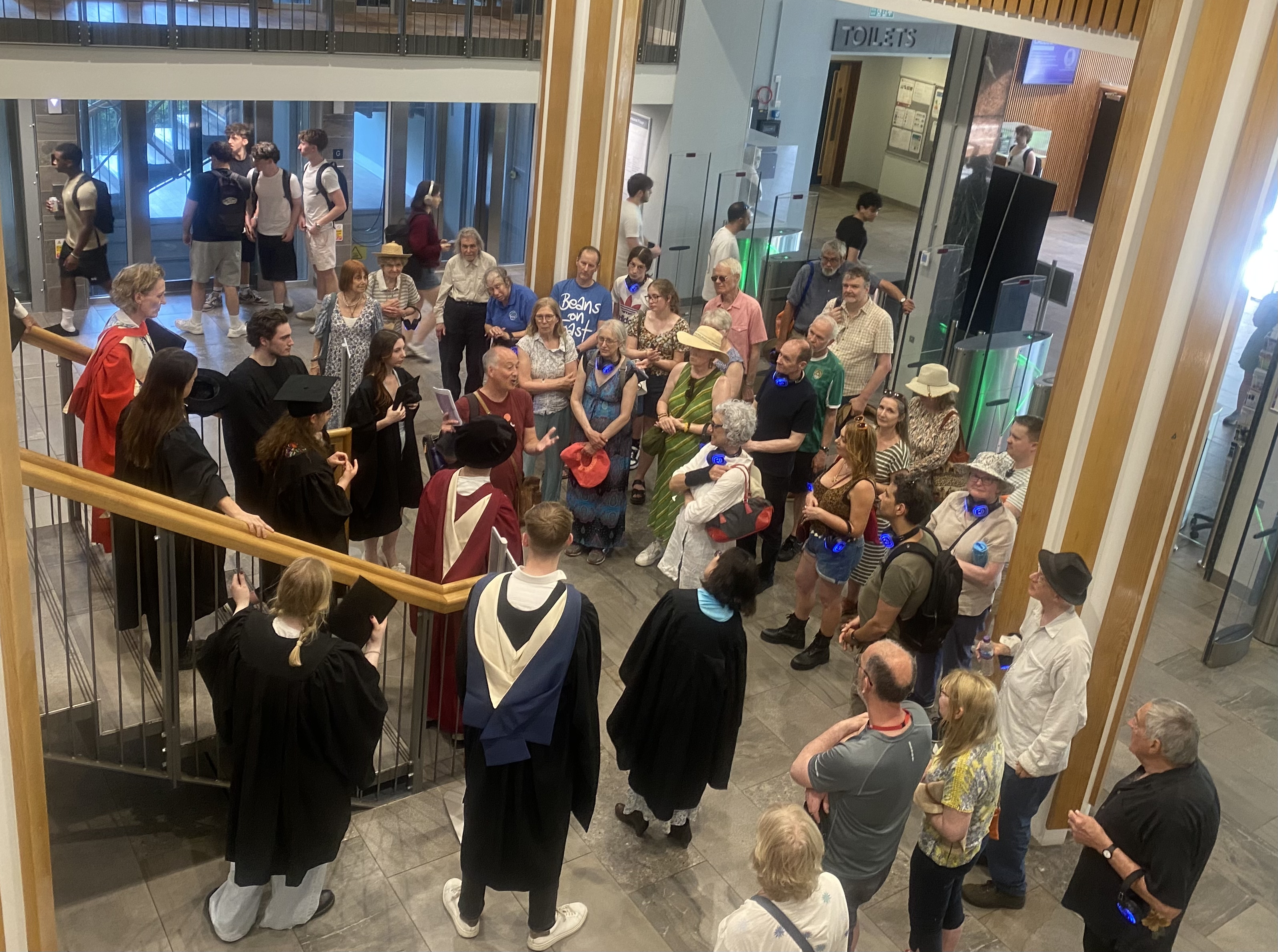 Small gathering of graduands and public