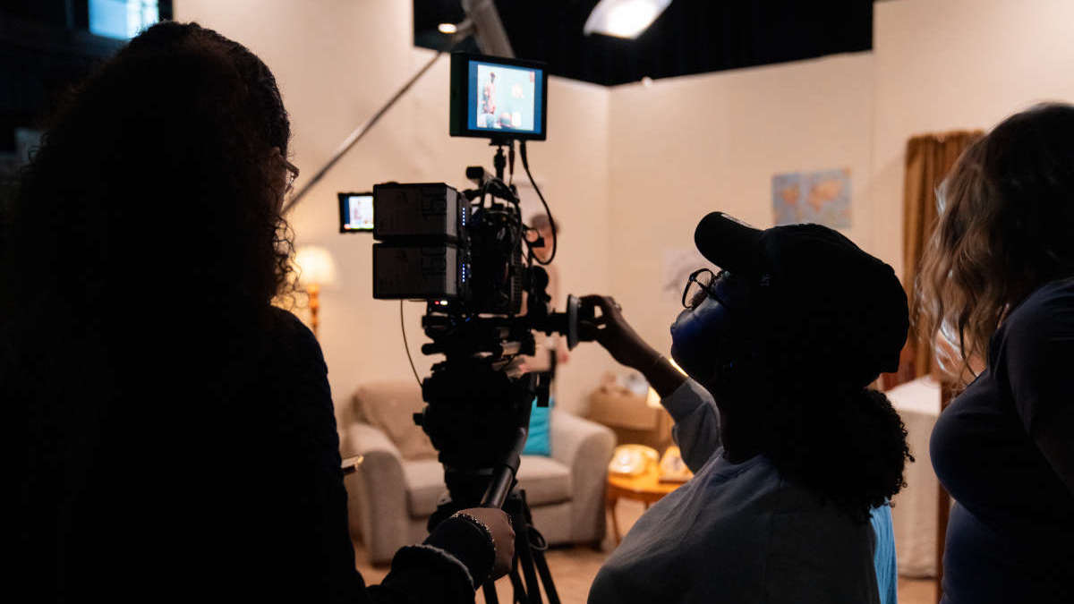 Students behind a studio camera in the Department of Film, Theatre and Television, at the University of Reading