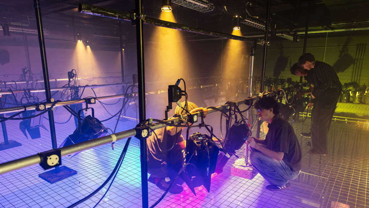 FTT students working with the lighting grid and studio lights at the University of Reading.