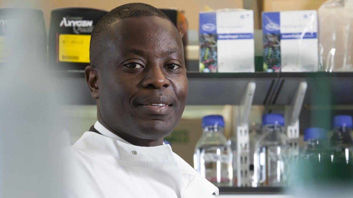 Male research scientist standing in a lab