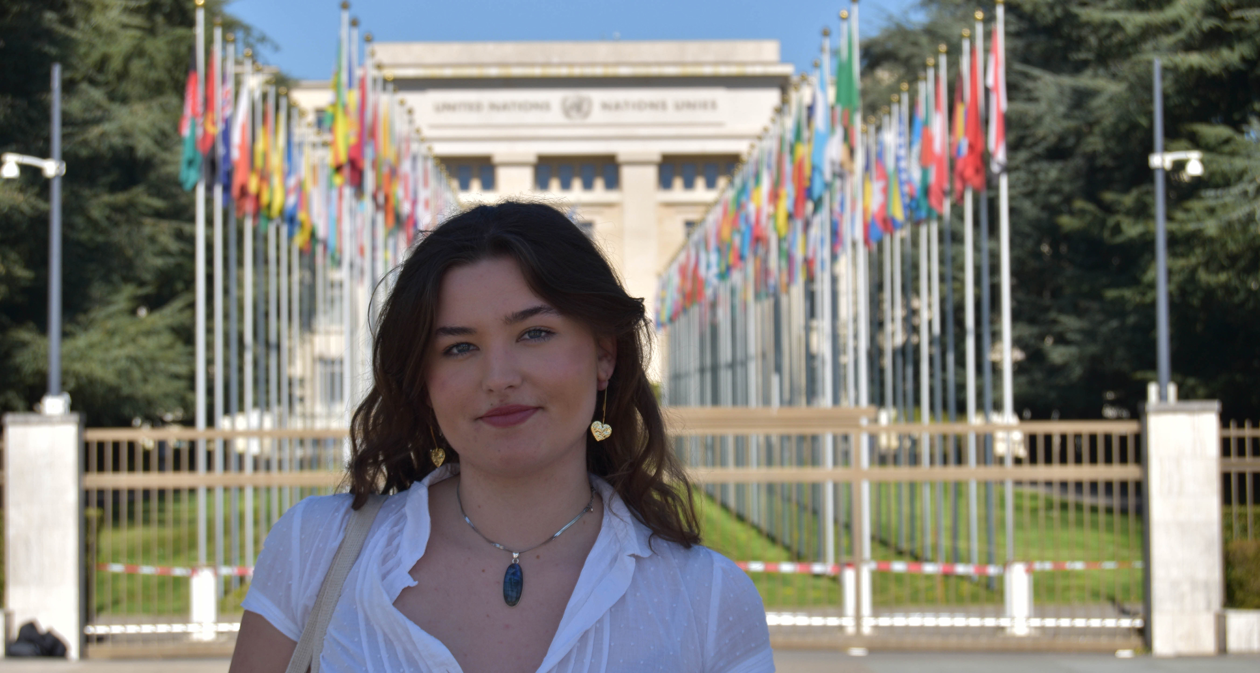 Student Megan Knapp stood in front of a row of flags.