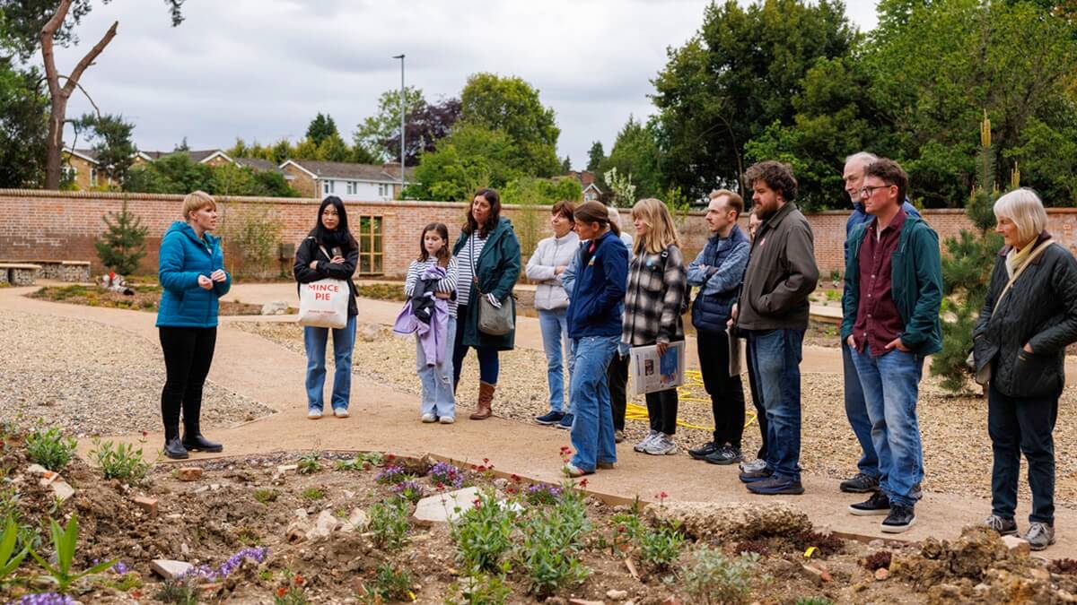 A group of community members in the Learning Garden